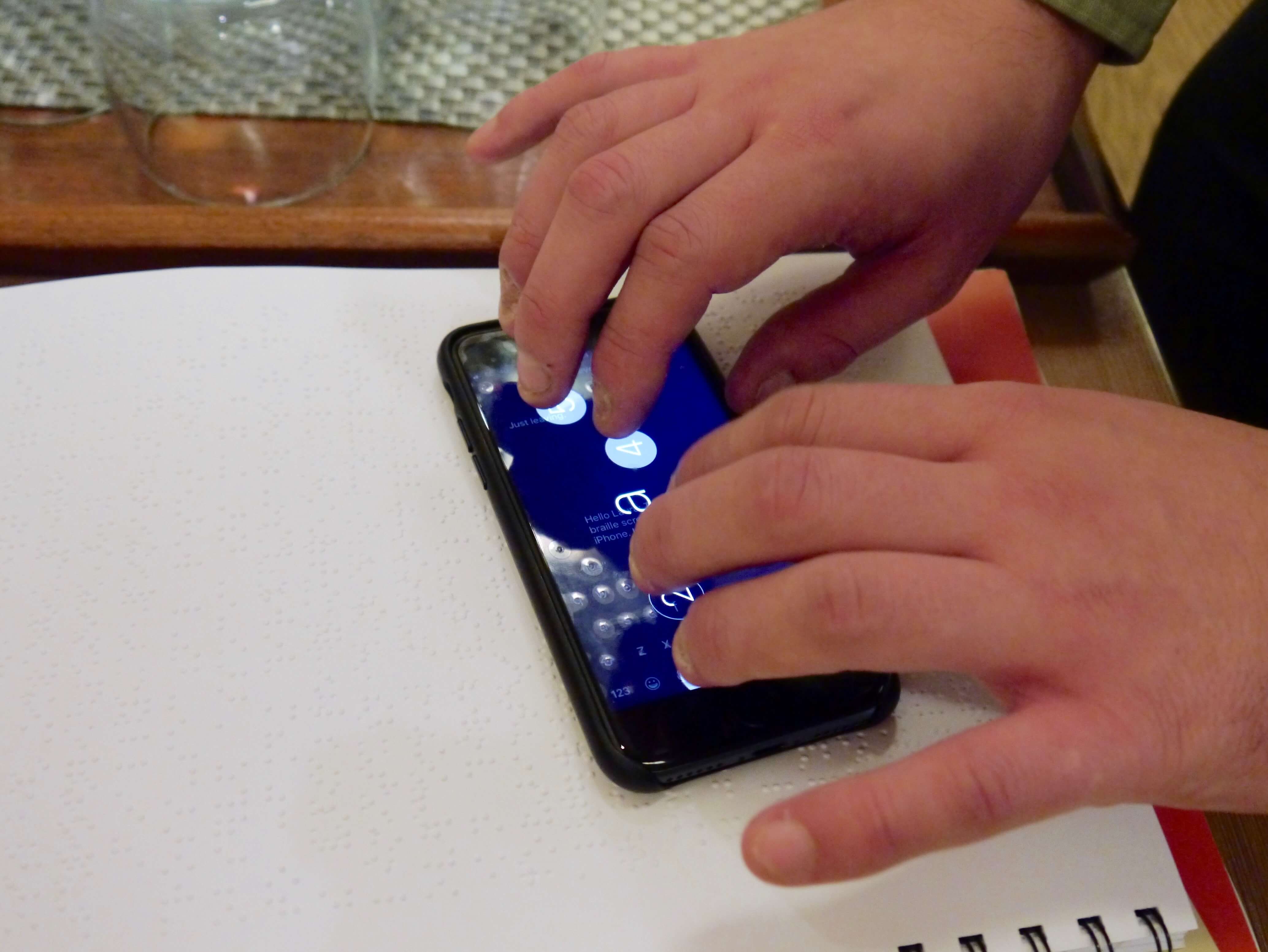 Photograph of the Braille keyboard in use on the iPhone