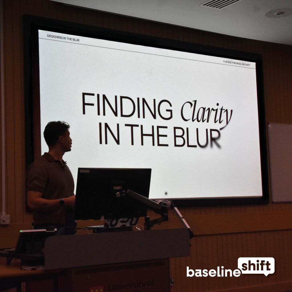 Albert parker standing in front of a screen giving a talk on Digital UX UI design as well as branding for Baseline Shift