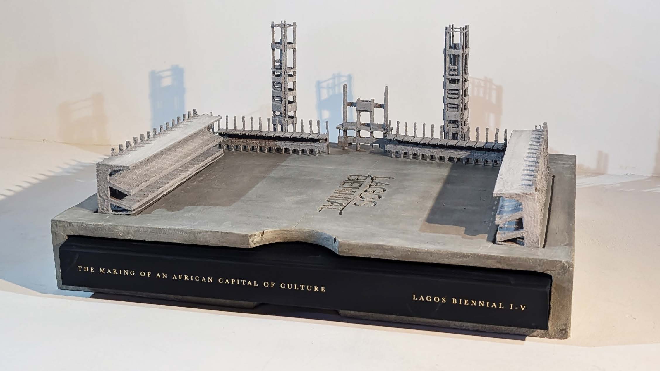 Lagos Biennial book encased within 7kg concrete bookcase